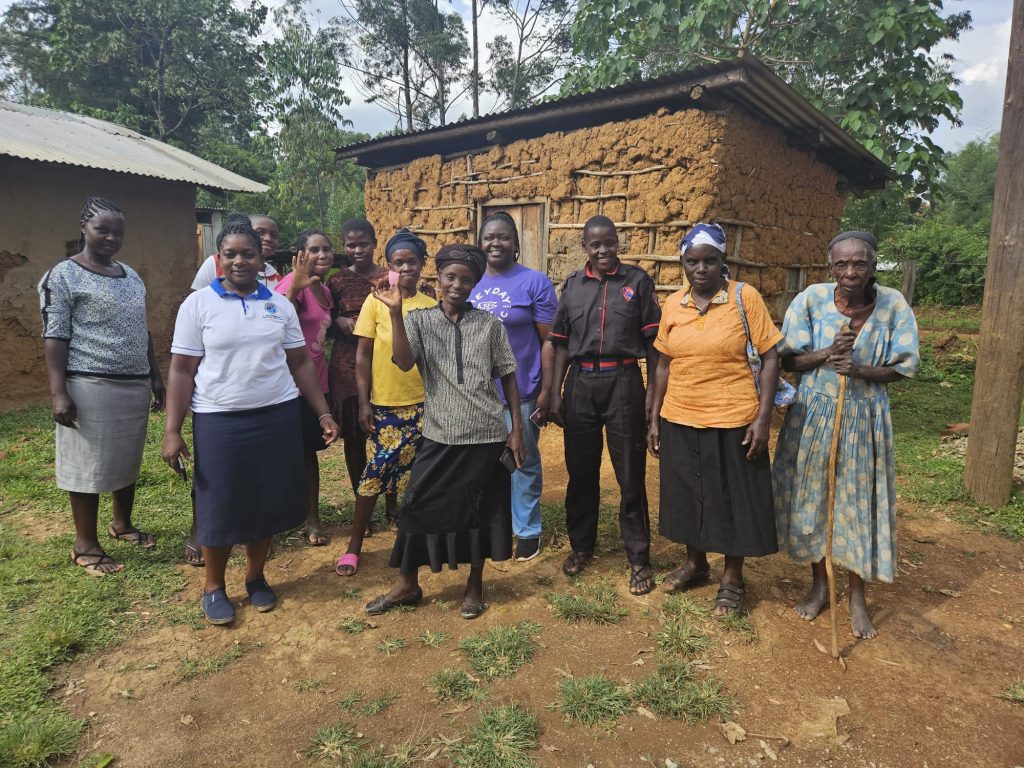 A group of women stood together, with some of them holding menstrual cups