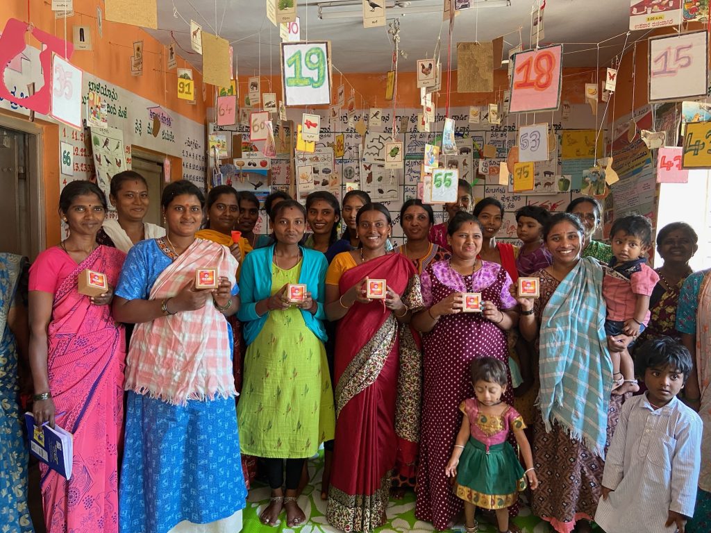 A group of women stood holding menstrual cups